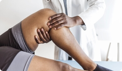 Bellmore Chiropractor working on a knee